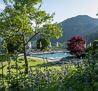 Söll-AlpenSchloessl-Hotel-Garten-Freischwimmbad