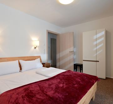 Söll Appartements-W20-Schlafzimmer Wilder Kaiser