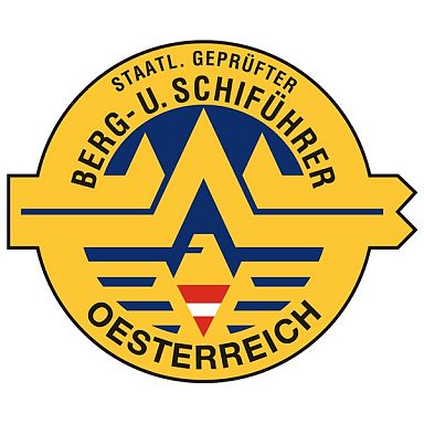 Logo der staatlich geprüften Berg- und Skiführer Österreichs, mit Bergsymbol und rotem Dreieck auf gelbem Hintergrund. Schriftzug in Schwarz.