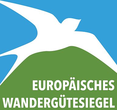 Logo showing a stylized white bird over a green hill on a blue background with the text "Europäisches" below.