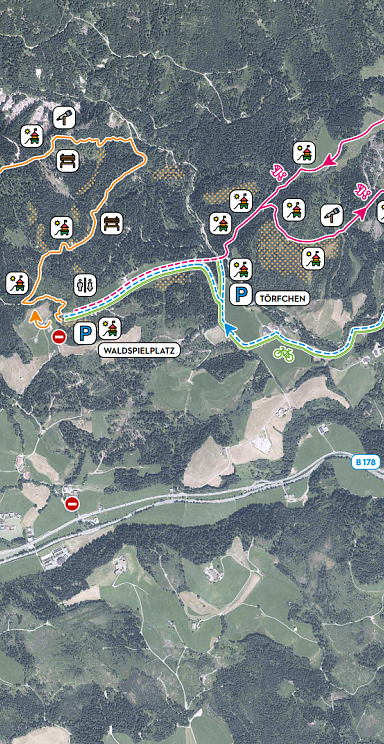 Karte der Region Wilder Kaiser mit markierten Wanderwegen, Hütten und Sehenswürdigkeiten. Farben zeigen unterschiedliche Routen und Schwierigkeitsgrade an.
