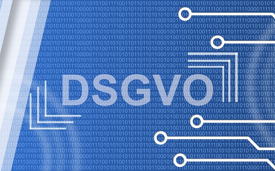 Blue digital graphic with DSGVO text, binary code, and circuit patterns, representing data protection and technology themes.